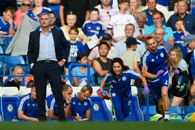 LONDON, ENGLAND - AUGUST 08: Chelsea manager Jose Mourinho looks on as team doctor Eva Carneiro rushes to treat Eden Hazard during the Barclays Premier League match between Chelsea and Swansea City at Stamford Bridge on August 8, 2015 in London, England.(Photo by Mike Hewitt/Getty Images)