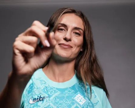 Alexia Putellas signs the camera with a marker pen while being presented as a new signing by London City Lionesses.